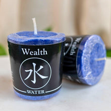 Load image into Gallery viewer, "Blue candle labeled 'Wealth Water' on a neutral background," - Down to Earth.
