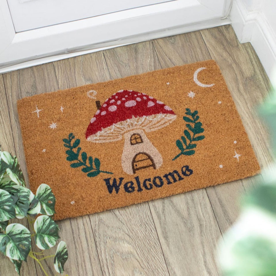 Mushroom House Welcome Doormat in front of a door - Down To Earth