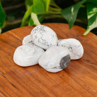 White Howlite Tumbled on a wooden surface - Down to Earth 
