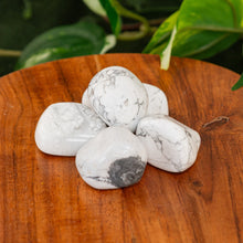 Load image into Gallery viewer, White Howlite Tumbled on a wooden surface high angle - Down to Earth 
