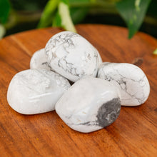 Load image into Gallery viewer, White Howlite Tumbled on a wooden surface close up - Down to Earth 
