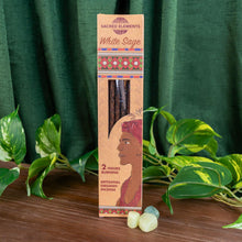 Load image into Gallery viewer, "Box of White Sage Sacred Elements Incense Sticks next to three green crystals on top of a wooden surface with green foliage in the background," - Down to Earth.
