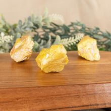 Load image into Gallery viewer, Yellow Aura Quartz Point side facing on a style background - Down To Earth
