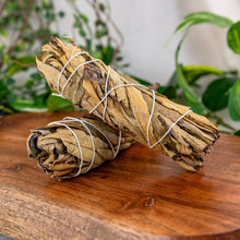 Load image into Gallery viewer, Yerba Santa Smudge Stick on a wooden surface side angle - Down to Earth
