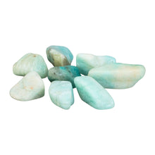 Load image into Gallery viewer, &quot;Collection of eight tumbled amazonite crystals against a white background,&quot; - Down to Earth.
