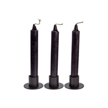 Load image into Gallery viewer, Photograph of three black ritual candles. These candles are sold by Down to Earth based out of Wichita, Kansas. - Down to Earth.
