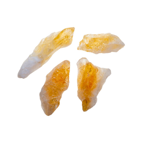 Photo of raw Citrine Points. Citrine points are natural formations  that do not require man-made shaping for their unique shape. Raw Citrine is yellow with varying depths of intensity, often having an ombre effect. - Down to Earth.