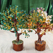 Load image into Gallery viewer, &quot;Two decorative trees with gemstones against a green curtain background,&quot; - Down to Earth.
