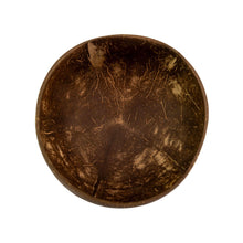 Load image into Gallery viewer, "Top-down view of a coconut shell bowl on a white background," - Down to Earth.

