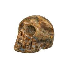 Load image into Gallery viewer, &quot;Left-side of a rhyolite crystal carved skull against a white background,&quot; - Down to Earth.
