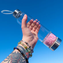 Load image into Gallery viewer, &quot;Clear water bottle with Rose Quartz crystal chips in the bottom chamber,&quot; - Down to Earth.

