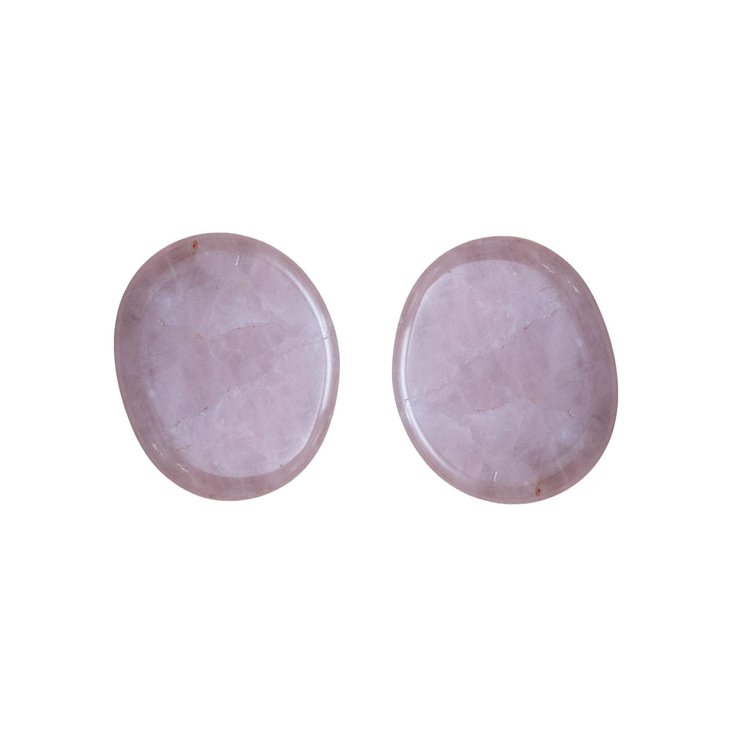 Picture of two tumbled rose quartz palm stones. Each stone is unique in its shape and color, and are approximately 1 to 2 inches long. - Down to Earth.