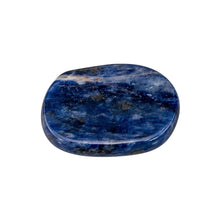 Load image into Gallery viewer, &quot;A round sodalite palm stone against a white background,&quot; - Down to Earth.
