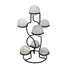 Load image into Gallery viewer, &quot;8.5&#39;&#39; metal sphere stand holding seven Selenite orbs on a white background,&quot; - Down to Earth.
