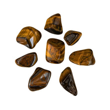 Load image into Gallery viewer, &quot;Collection of tiger&#39;s eye tumbled crystals on a white background,&quot; - Down to Earth.
