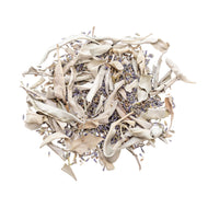A pile of dried white sage and lavender with a white backdrop. This is a herbal mix sold on our website at www.thedowntoearth.com. - Down to Earth.